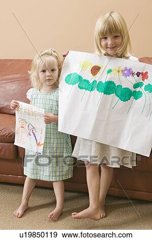 3 and 5 year old girls showing off their artwork, Vancouver, BC View Large Photo Image Stock Photo - 3 and 5 year old girls showing off their artwork, Vancouver, BC. Fotosearch