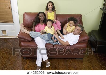 Stock Photograph - AA mom, Caucasian dad, Mulatto Children, Boy 1. 5 years, girl 3 years, girl 6 years.. Fotosearch