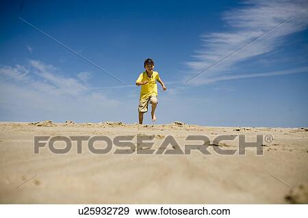 Boy (7) runs toward camera, Grand Beach Provincial Park, Manitoba View Large Photo Image Stock Photo - Boy (7) runs toward camera, Grand Beach Provincial Park, Manitoba. Fotosearch