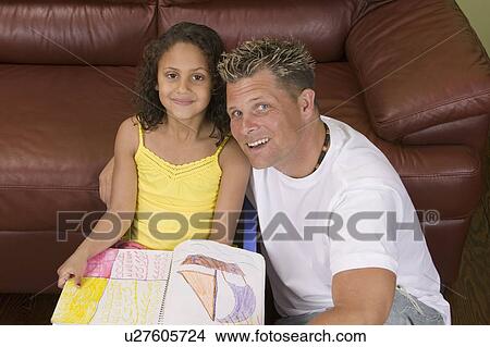 Picture - Caucasian father with Mulatto girl (6 years old) at artwork. Fotosearch