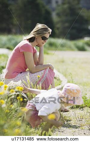 Stock Photography - Caucasian Mom and 4 year old Daughter, a day on the beach. Sunset Beach, Vancouver, BC. Fotosearch
