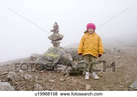 Stock Photo - Girl - 5 years old on the top of the mountain, Tatra Mountains, Poland. Fotosearch