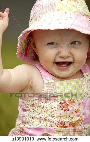 Laughing toddler wearing sunhat, Saskatchewan, Canada View Large Photo Image Stock Photo - Laughing toddler wearing sunhat, Saskatchewan, Canada. Fotosearch