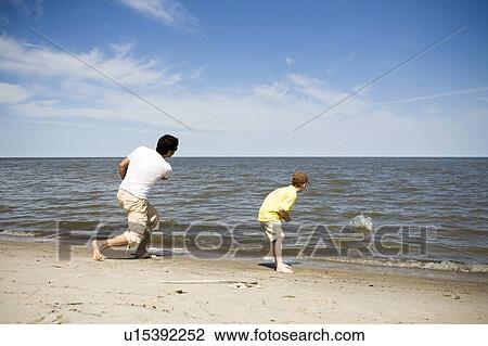Man and boy (7) skipping stones, Grand Beach Provincial Park, Manitoba, Canada View Large Photo Image Stock Image - Man and boy (7) skipping stones, Grand Beach Provincial Park, Manitoba, Canada. Fotosearch