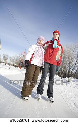 Portrait of 9 and 13-year old girls in skates, The Forks, Winnipeg, Canada View Large Photo Image Stock Image - Portrait of 9 and 13-year old girls in skates, The Forks, Winnipeg, Canada. Fotosearch