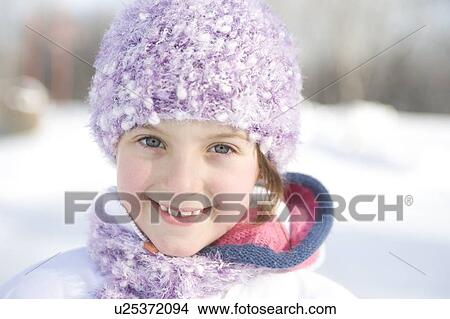 Picture - Portrait of 9 year-old girl outdoor in winter, Winnipeg, Canada. Fotosearch
