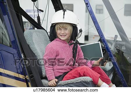 Young Girl (4 years old) in a Helicopter, 2006 Abbotsford International Airshow. View Large Photo Image Picture - Young Girl (4 years old) in a Helicopter, 2006 Abbotsford International Airshow.. Fotosearch