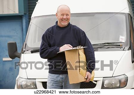 Deliveryperson standing with van with clipboard and box smiling View Large Photo Image Stock Image - Deliveryperson standing with van with clipboard and box smiling. Fotosearch