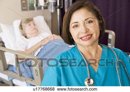 Stock Photo - Doctor Standing In Patients Room. Fotosearch