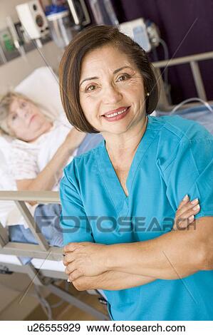 Doctor Standing With Arms Crossed In Her Patients Room View Large Photo Image Stock Photo - Doctor Standing With Arms Crossed In Her Patients Room . Fotosearch
