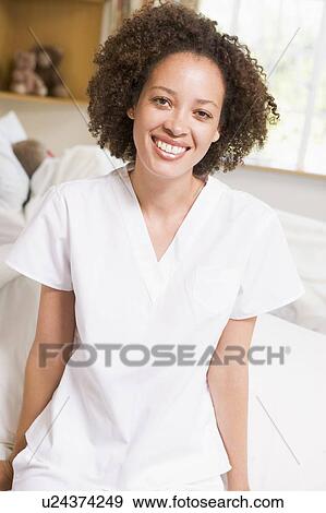 Nurse Sitting On Hospital Bed View Large Photo Image Stock Photo - Nurse Sitting On Hospital Bed. Fotosearch