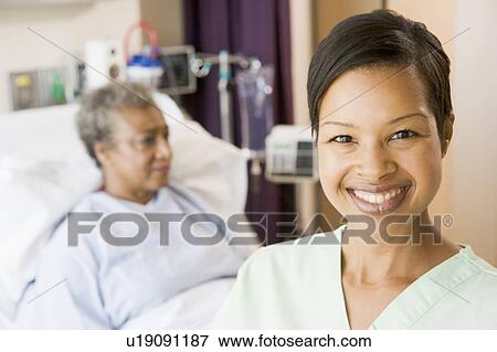 Nurse Standing In Patients Room View Large Photo Image Stock Photo - Nurse Standing In Patients Room. Fotosearch