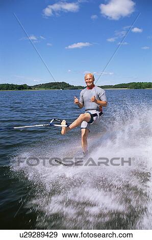 Stock Photo - Man water skiing. Fotosearch