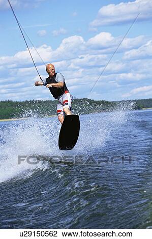 Man waterskiing View Large Photo Image Stock Image - Man waterskiing. Fotosearch