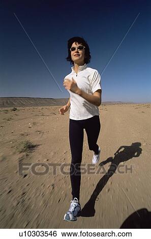 Woman outdoors running on the beach (blur) View Large Photo Image Stock Photograph - Woman outdoors running on the beach (blur). Fotosearch