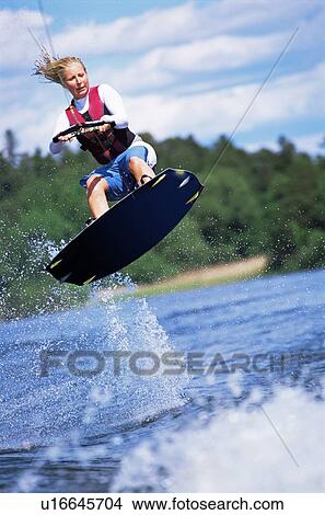 Woman waterskiing View Large Photo Image Picture - Woman waterskiing. Fotosearch