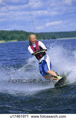 Woman waterskiing View Large Photo Image Stock Image - Woman waterskiing. Fotosearch