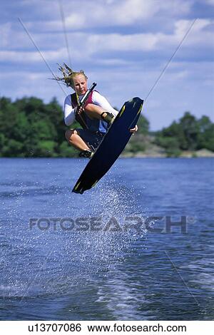 Stock Photograph - Woman waterskiing. Fotosearch