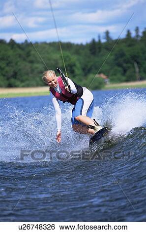 Stock Photograph - Woman waterskiing. Fotosearch