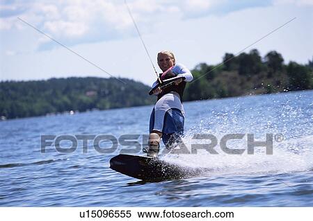 Woman waterskiing View Large Photo Image Stock Photography - Woman waterskiing. Fotosearch