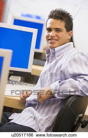 Stock Photograph - Male student in computer class. Fotosearch
