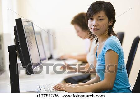 Stock Photograph - Two women in computer room. Fotosearch