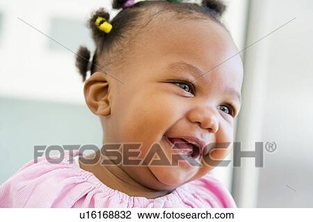 Baby indoors laughing View Large Photo Image Stock Image - Baby indoors laughing. Fotosearch
