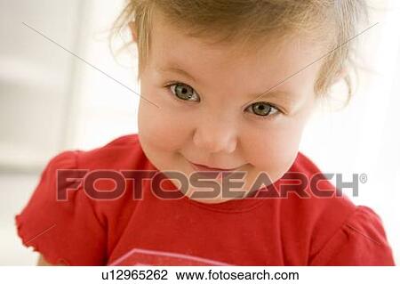Baby indoors smiling View Large Photo Image Stock Image - Baby indoors smiling. Fotosearch
