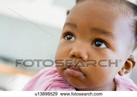 Stock Photo - Baby indoors. Fotosearch