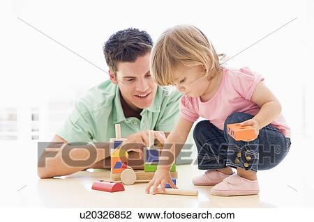 Father and daughter indoors playing and smiling View Large Photo Image Stock Image - Father and daughter indoors playing and smiling. Fotosearch
