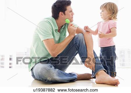 Father and daughter indoors playing View Large Photo Image Stock Image - Father and daughter indoors playing. Fotosearch