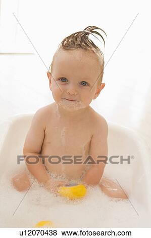Baby in bubble bath View Large Photo Image Stock Photo - Baby in bubble bath. Fotosearch