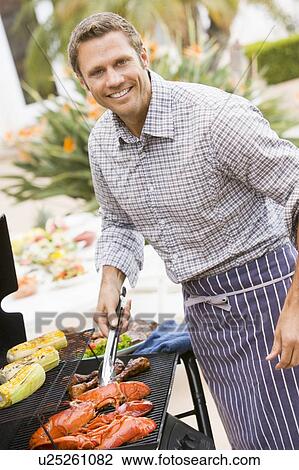 Man Barbequing In A Garden View Large Photo Image Stock Image - Man Barbequing In A Garden. Fotosearch