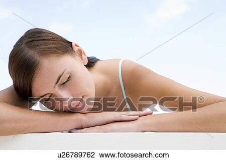 Woman posing outdoors with eyes closed View Large Photo Image Stock Image - Woman posing outdoors with eyes closed. Fotosearch