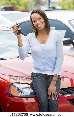 Woman shopping for a new car View Large Photo Image Stock Photography - Woman shopping for a new car. Fotosearch