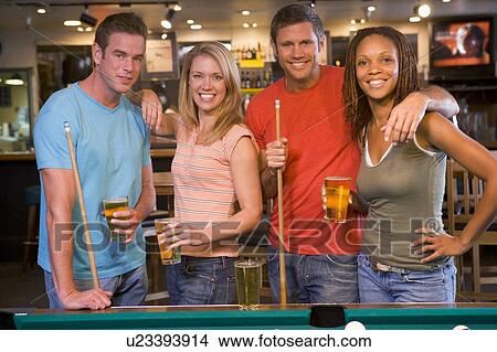 Friends at a pool hall View Large Photo Image Picture - Friends at a pool hall. Fotosearch