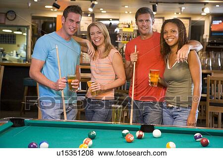 Friends at a pool hall View Large Photo Image Stock Photo - Friends at a pool hall. Fotosearch