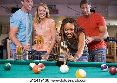 Friends playing pool View Large Photo Image Stock Photograph - Friends playing pool. Fotosearch