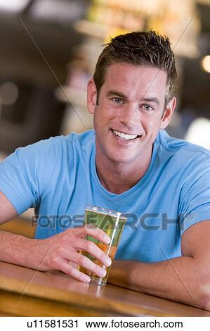 Man having a glass of beer View Large Photo Image Stock Image - Man having a glass of beer. Fotosearch