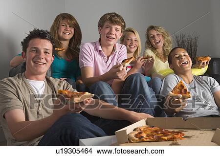 Picture - Teenagers Having Fun And Eating Pizza. Fotosearch