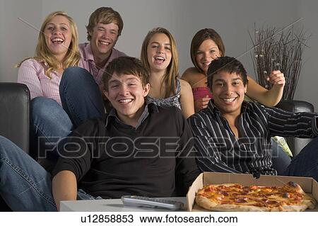 Stock Image - Teenagers Having Fun And Eating Pizza. Fotosearch