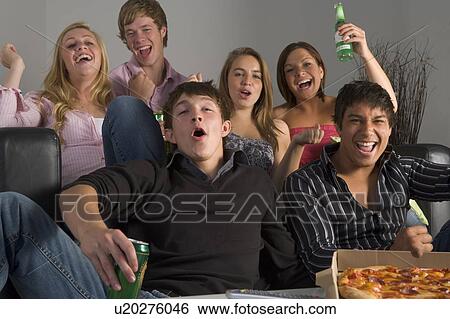 Stock Photograph - Teenagers Having Fun And Eating Pizza. Fotosearch