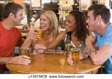 Two couples having beer together View Large Photo Image Stock Photo - Two couples having beer together. Fotosearch
