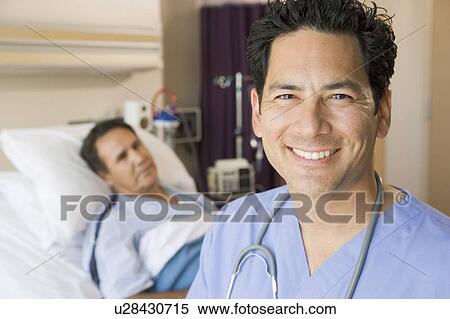 Stock Photography - Doctor Smiling In Patients Room. Fotosearch