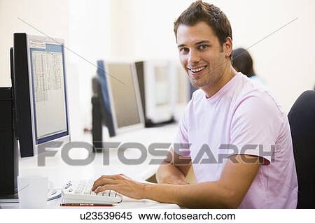 Man in computer room smiling View Large Photo Image Stock Photography - Man in computer room smiling. Fotosearch