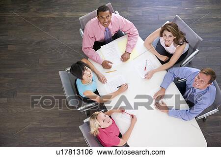Five businesspeople at boardroom table View Large Photo Image Stock Photograph - Five businesspeople at boardroom table. Fotosearch