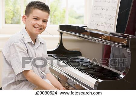 Boy Playing Piano View Large Photo Image Picture - Boy Playing Piano. Fotosearch
