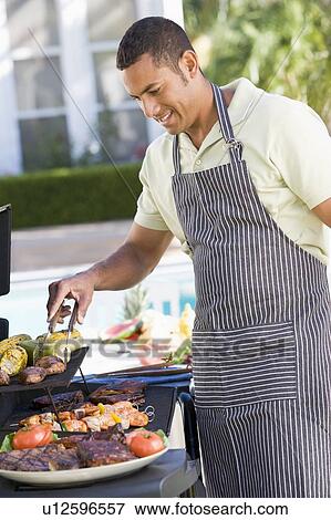 Man Barbequing In A Garden View Large Photo Image Stock Photo - Man Barbequing In A Garden. Fotosearch