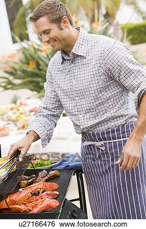Man Barbequing In A Garden View Large Photo Image Stock Photograph - Man Barbequing In A Garden. Fotosearch