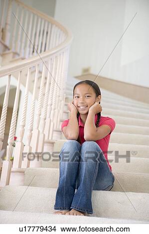 Young Girl Sitting On A Stairwell At Home View Large Photo Image Picture - Young Girl Sitting On A Stairwell At Home. Fotosearch